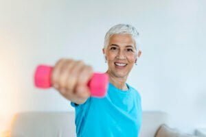 senior woman exercise with dumbbells home elderly woman prefers healthy lifestyle