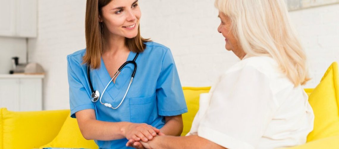 medium-shot-caregiver-old-woman-holding-hands